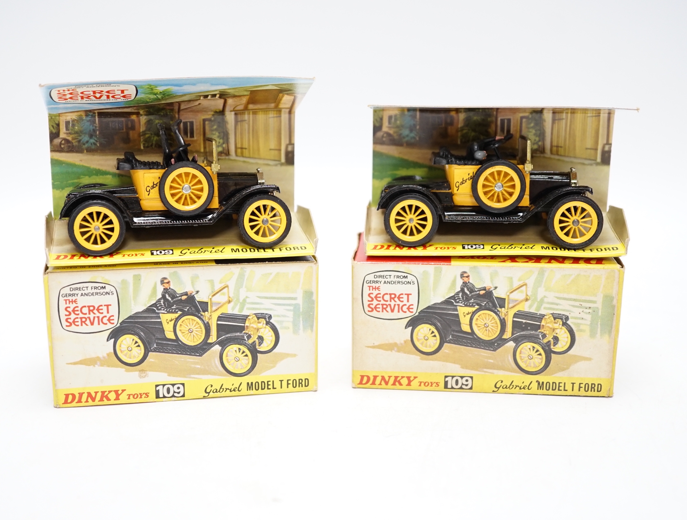 Two Dinky Toys (109) Gabriel Model T Ford, both boxed with inner display stands